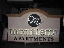 Double face aluminum monument signs with push thru logo and front and back lit  channel letters illuminated with LEDS